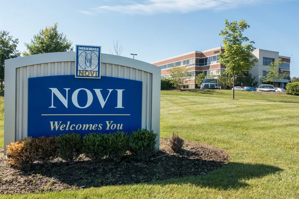 The &ldquo;Novi Welcomes You&rdquo; sign on 9 Mile Road