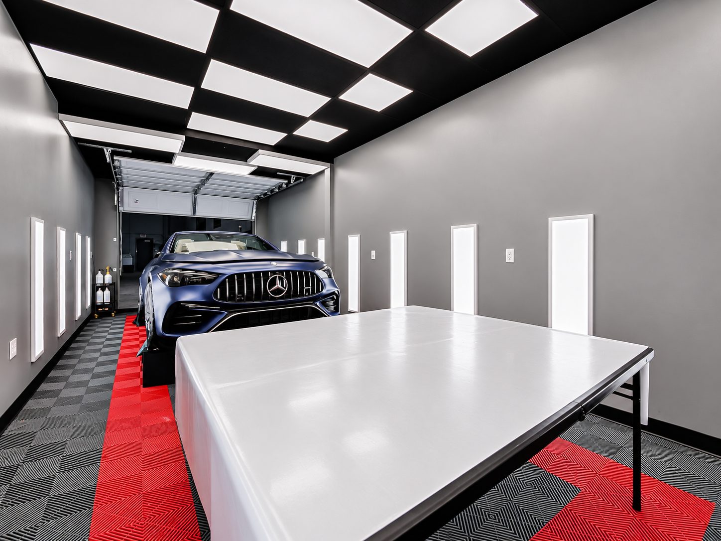 Warehouse suite built out as an auto detailing bay with LED lighting and tile floor