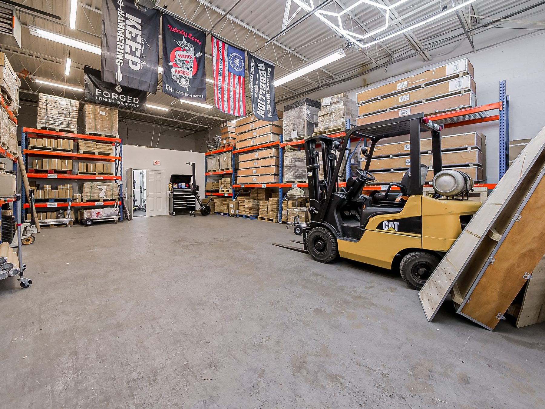 Warehouse suite used for distribution with pallet racking and a forklift